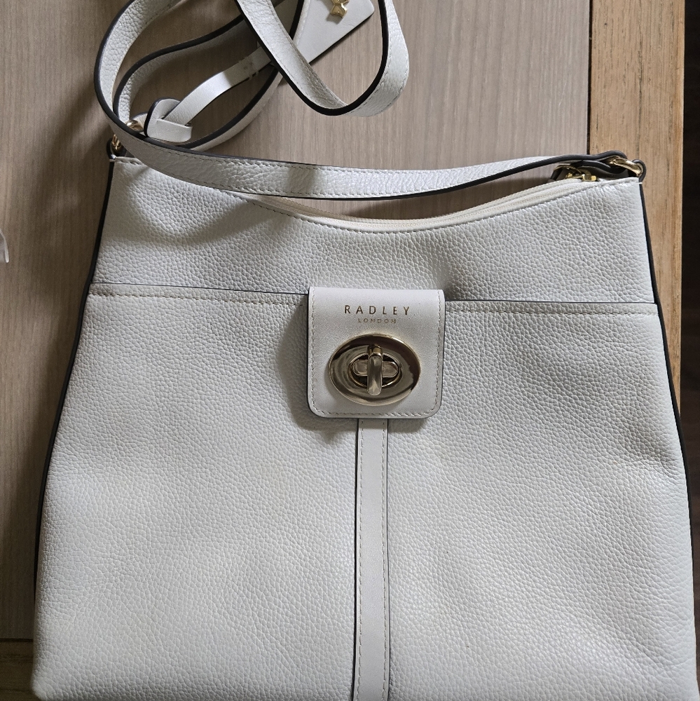 Radley London 
Longacre Small Crossbody 
Top Zip Closure
Genuine Leather
White